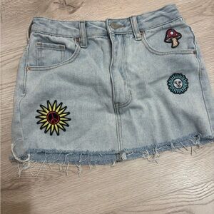 PACSUN size 23” waist Light Blue Denim Mini Skirt with Fun Patches. EUC